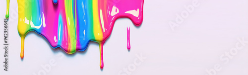 Close-up of macro multicolored rainbow splashes and drips of thick paint in motion on white background with copy space