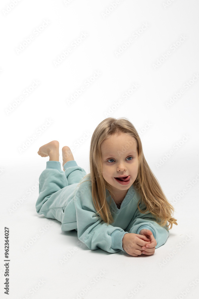 Portrait of beautiful cute little toddler girl. Child with funny face. Pretty smile kid in studio on white background. High quality photo Portrait of beautiful cute little toddler girl. Child with funny face. Pretty smile kid in studio on white background. High quality photo