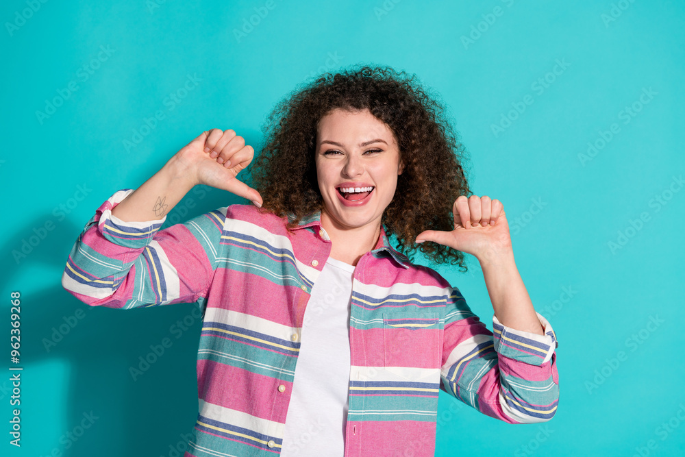 Photo of pretty young woman point fingers herself wear shirt isolated on teal color background Photo of pretty young woman point fingers herself wear shirt isolated on teal color background