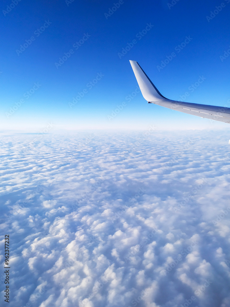 airplane tail in the clouds high in the sky airplane tail in the clouds high in the sky