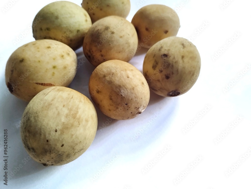 Duku fruit or Lansium domesticum still has its skin and is fresh on a white background Duku fruit or Lansium domesticum still has its skin and is fresh on a white background