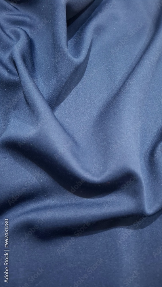 Fototapeta premium Smooth elegant blue silk or satin luxury cloth texture can use as abstract background.Blue cloth or liquid wave or wavy folds of grunge silk texture satin velvet material. Christmas background. Vector