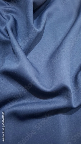 Smooth elegant blue silk or satin luxury cloth texture can use as abstract background.Blue cloth or liquid wave or wavy folds of grunge silk texture satin velvet material. Christmas background. Vector