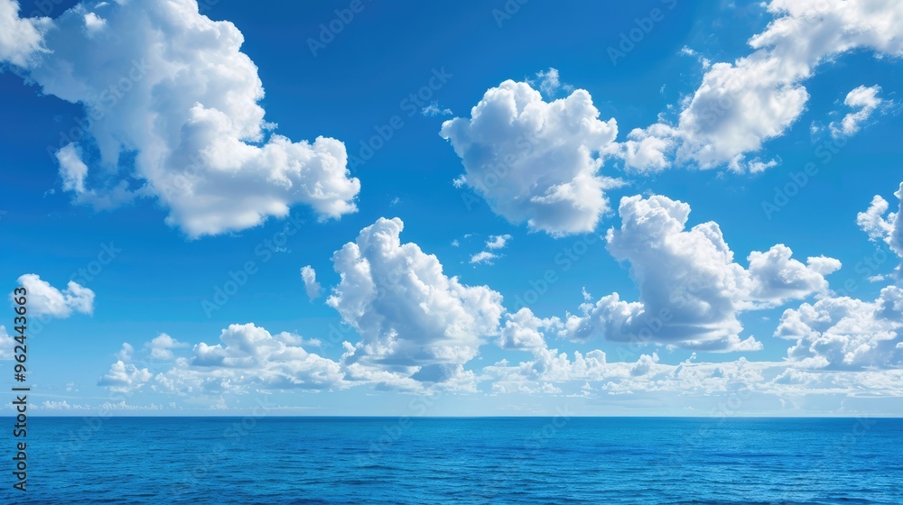 Bright blue morning sky with white clouds and deep indigo ocean in daylight creates a serene backdrop. Bright blue morning sky with white clouds and deep indigo ocean in daylight creates a serene backdrop.
