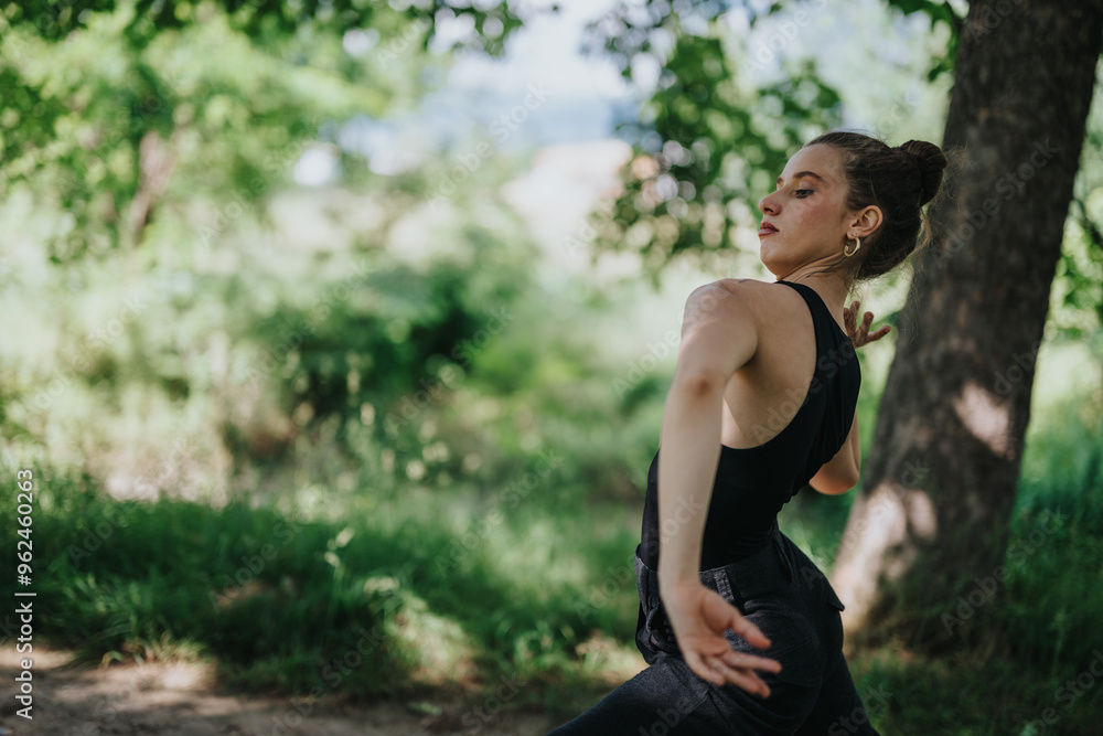 Graceful female dancer in a serene outdoor setting, performing modern dance movements and expressing beauty in nature. Graceful female dancer in a serene outdoor setting, performing modern dance movements and expressing beauty in nature.