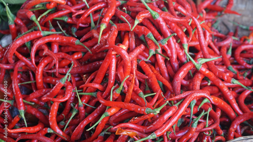 Fototapeta premium Red chili in a bamboo basket. Focus selected