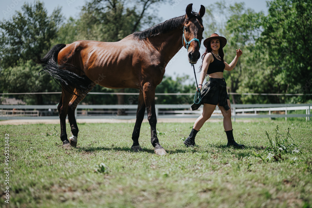 Woman experiencing countryside life while walking with a horse at the ranch on a sunny day. Woman experiencing countryside life while walking with a horse at the ranch on a sunny day.