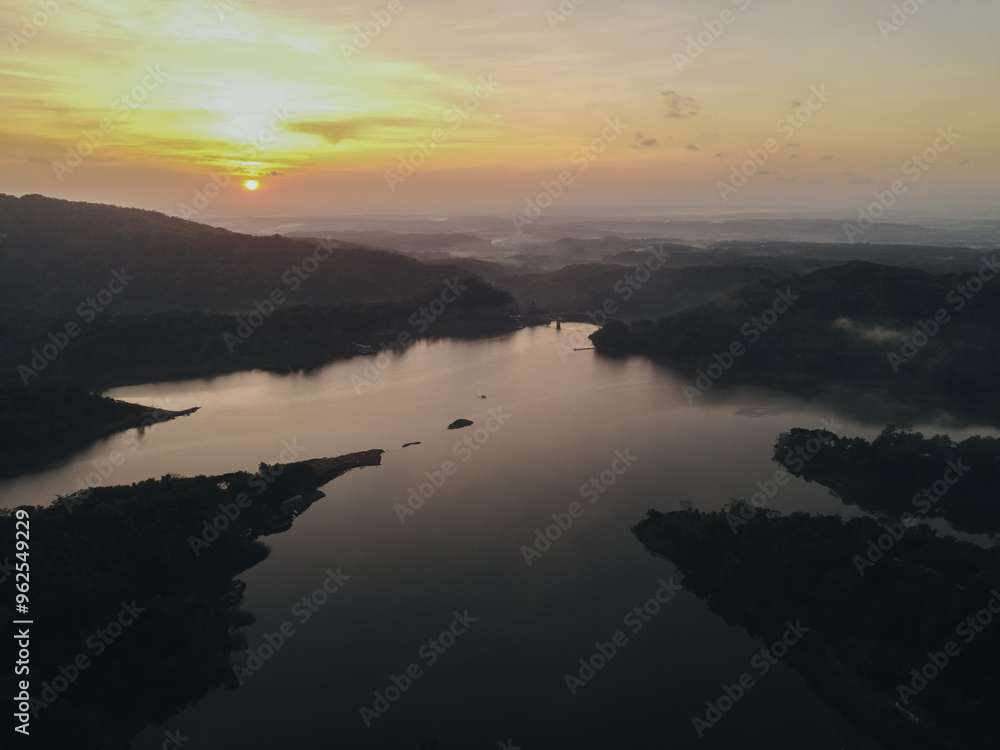 Fototapeta premium Top aerial view landscape of clear lake named Sermo lake on a bright day.