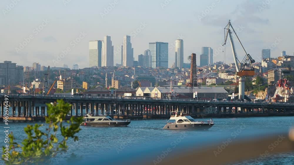 View across the Golden Horn waterway to the business center in the Istanbul European side. Yachts and skyscrapers in the background View across the Golden Horn waterway to the business center in the Istanbul European side. Yachts and skyscrapers in the background