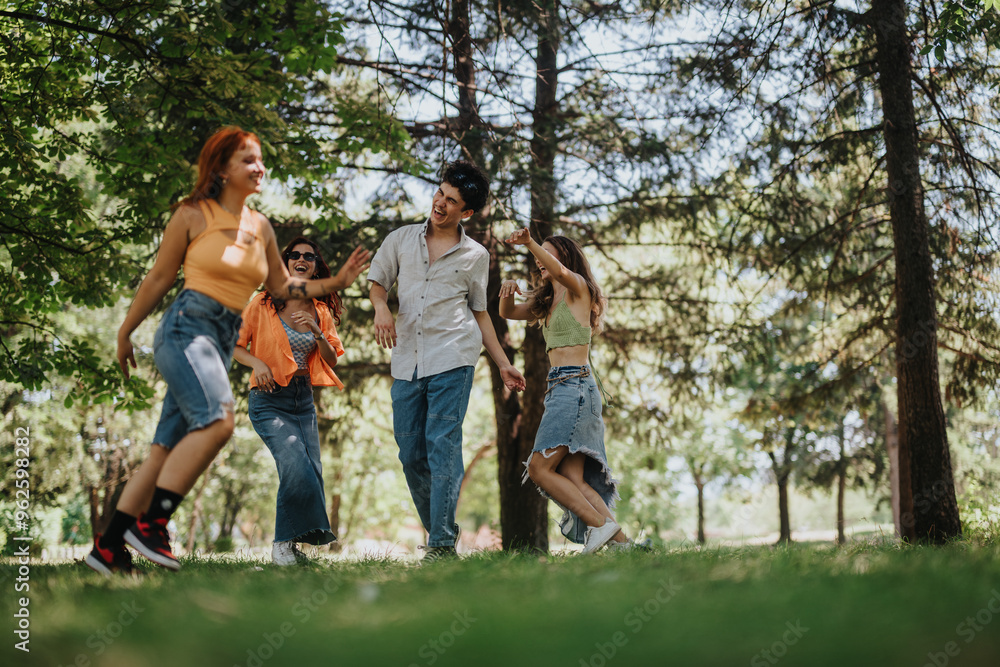 Fototapeta premium Young people enjoying a fun day in the park. They're running in circles, laughing, and creating beautiful friendship memories together.