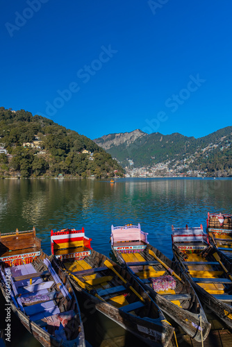 Boats tied at the banks of the famous Naini lake in Nainital, a preferred summer tourist in India. Clicked on 2 January 2022.
