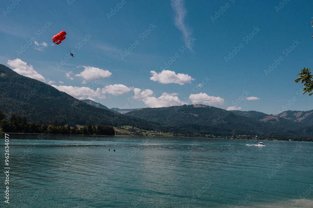 paragliding in the mountains on a lake paragliding in the mountains on a lake