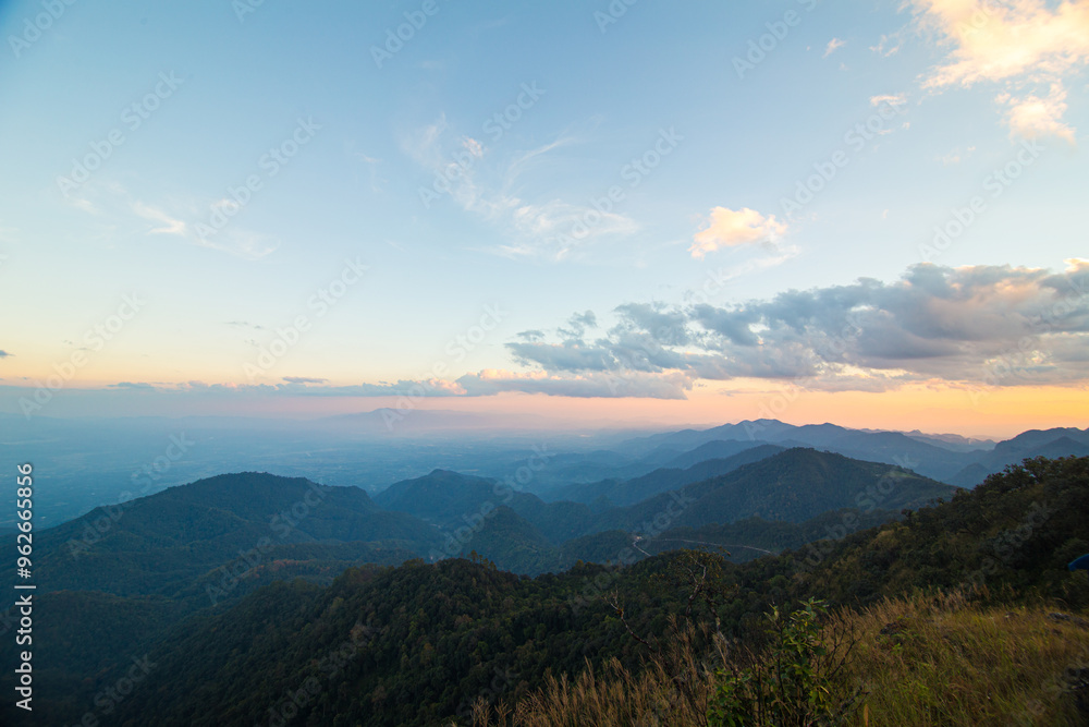 Obraz premium Colorful sky sunset on peak of mountain tropical forest