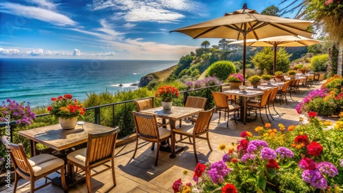 Breathtaking ocean views of a seaside eatery's outdoor patio on a scenic Pacific Coast Highway, surrounded by lush greenery and vibrant flowers.