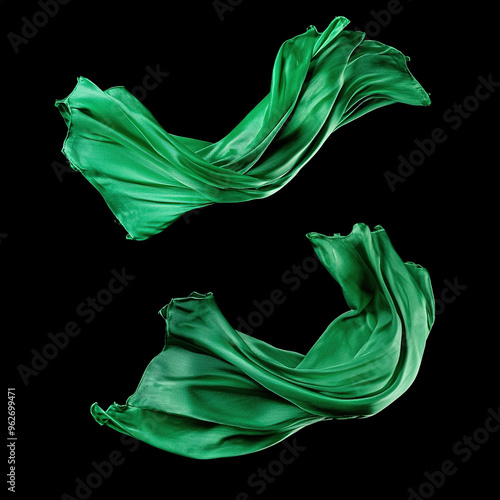 Emerald green silk draped and intertwined against a black background, featuring high-detail and luxurious texture. Ideal for high-resolution backgrounds, fashion textiles, and sophisticated designs.