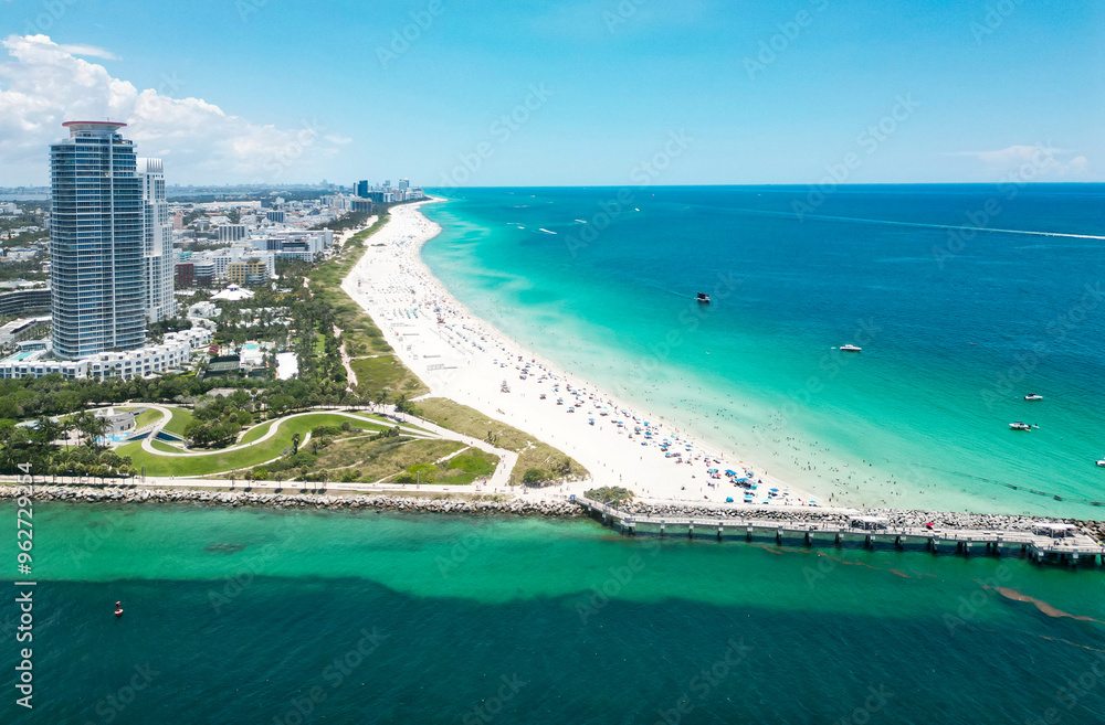Obraz premium Aerial view of beautiful Miami Beach city, Florida, United States. Drone shot of Miami on sunny day. Miami Beach, wonderful aerial view of buildings. Panorama view of Miami Beach, South Beach, USA.