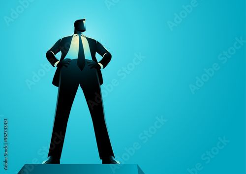 Confident businessman standing tall with hands on hips, viewed from a low angle. This powerful perspective emphasizes the businessman's authority, strength, and leadership