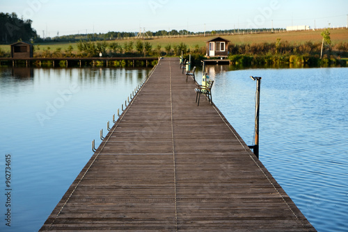 a floating pier or bridge for crossing a lake and fishing from the pier