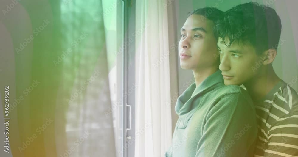Embracing by window, couple with rainbow light animation Embracing by window, couple with rainbow light animation