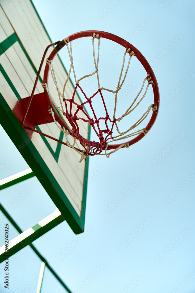 A basketball hoop and blue sky A basketball hoop and blue sky
