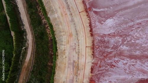 Red Mud Pond In Xove. aerial topdown shot photo