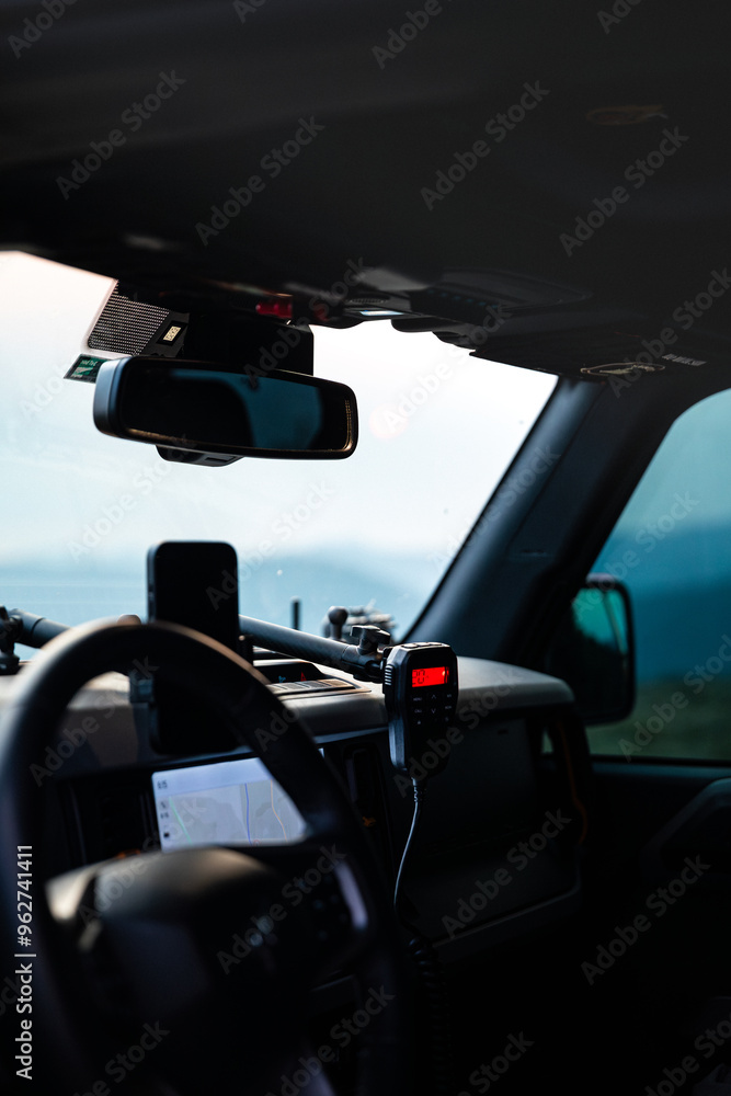View through windshield of featuring phone, radio, and navigation map View through windshield of featuring phone, radio, and navigation map
