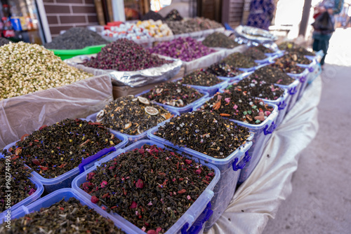 A table full of different colored spices photo