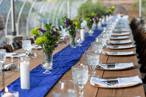 Long communal table set for dinner service