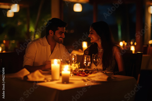 Young Indian Couple doing candle light dinner.