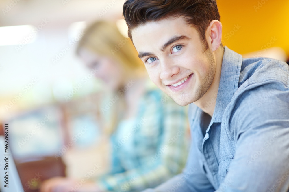 Education, portrait and study with student man in library at college or university campus for learning. Development, face and happy with confident person at school desk or table for scholarship Education, portrait and study with student man in library at college or university campus for learning. Development, face and happy with confident person at school desk or table for scholarship
