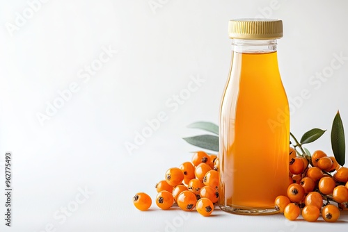 Fresh Sea Buckthorn Juice Bottle With Sea Buckthorn Berries isolated on a white background