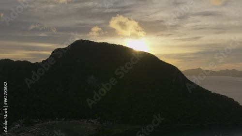 Sunset over El Nido. Tourboats floating near the coastline. Palawan in the Philippines. photo