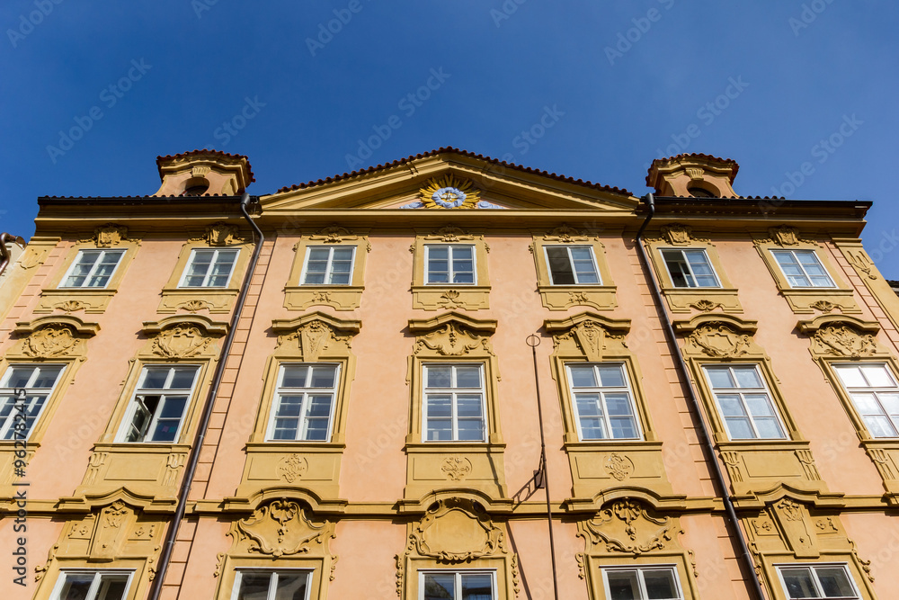 Yellow facade of a historic house in Prague, Czechia