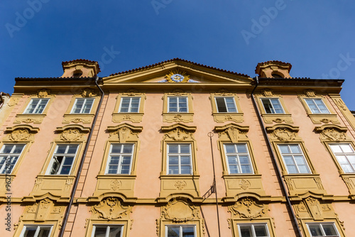 Obraz na płótnie Yellow facade of a historic house in Prague, Czechia w salonie