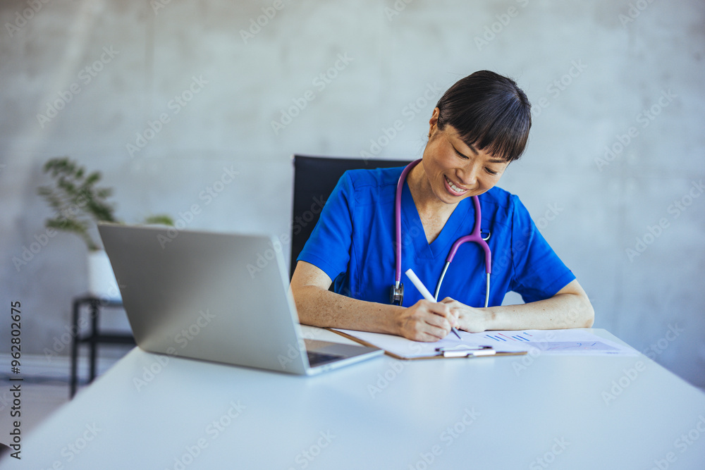 Smiling Nurse Writing Notes in a Modern Office Setting Smiling Nurse Writing Notes in a Modern Office Setting