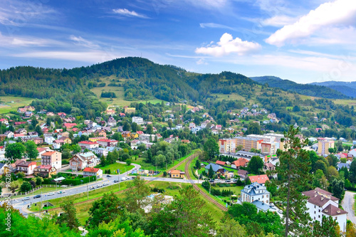 Fototapeta Naklejka Na Ścianę i Meble -  View at the town and nearest mountains from the ruins of a medieval castle in Muszyna, Poland