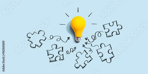 Quadro su tela Jigsaw puzzle with a yellow light bulb - flat lay
