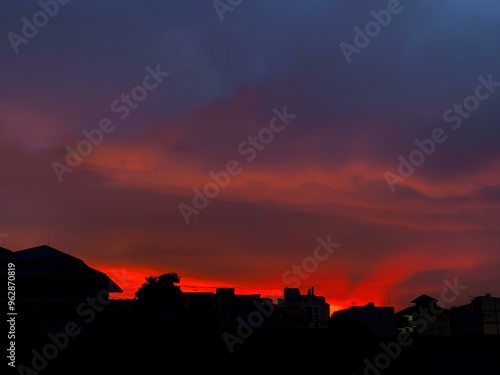 Fiery Sunset Sky Over City Silhouettes.