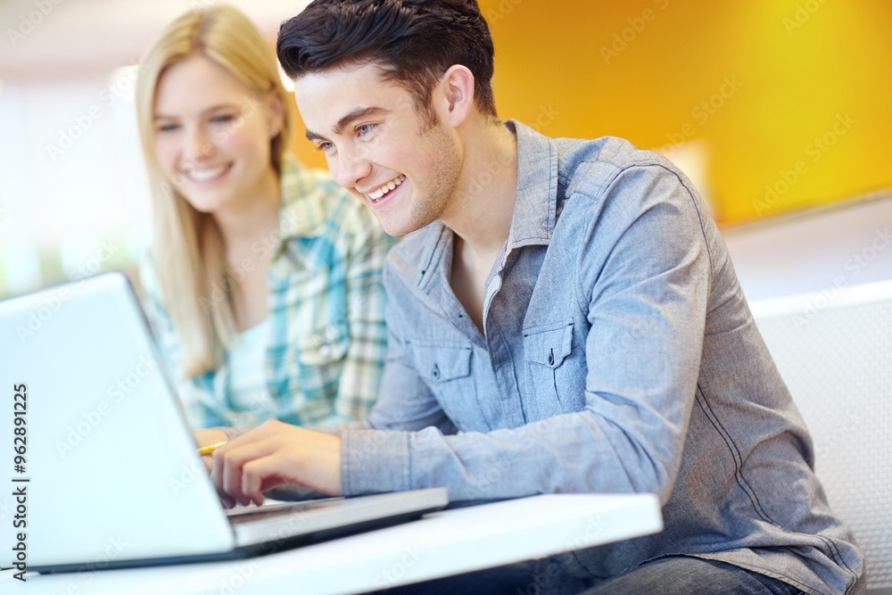 Education, laptop and reading with student friends in library on campus of college or university for development. Computer, smile and study with happy people at desk or table for research or typing Education, laptop and reading with student friends in library on campus of college or university for development. Computer, smile and study with happy people at desk or table for research or typing