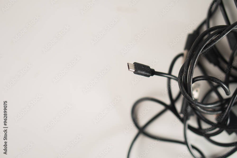 Tangled Black US B Cables on White Background Tangled Black US B Cables on White Background