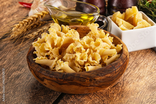 Raw dry Italian pasta - campanelle photo