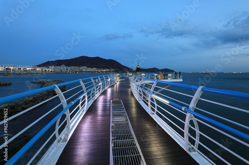 Songdo, Seo-gu, Busan, South Korea - January 15, 2021: Night view of trail with a lighthouse on the sea
 photo