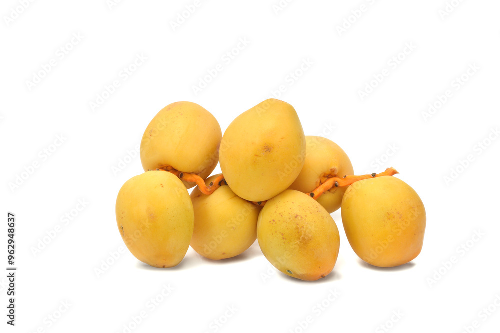 Fresh ripe yellow dates fruits branch isolated on white Fresh ripe yellow dates fruits branch isolated on white