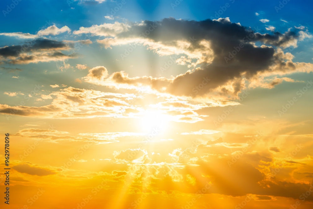 Fototapeta premium Sunset sky background with sun and sunset clouds