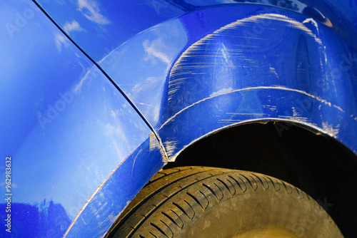 Obraz na płótnie Closeup of damaged car front fender, deep dent and scratched arch, impact of collision and the need for vehicle body repair.. w salonie