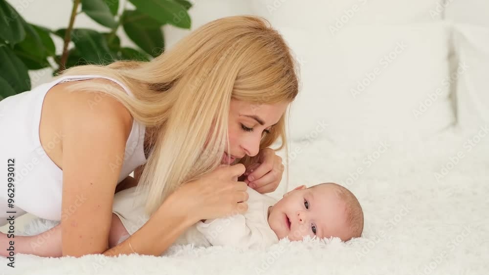 mom and baby hug and kiss, a young mother gently hugs a newborn baby girl holding him in her arms, maternal love and care, a young family, mother and daughter mom and baby hug and kiss, a young mother gently hugs a newborn baby girl holding him in her arms, maternal love and care, a young family, mother and daughter