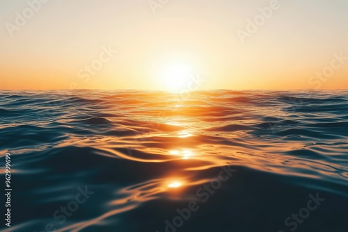 Serene sunset over calm ocean waves.