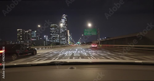 Car drive on Seoul city streets at night