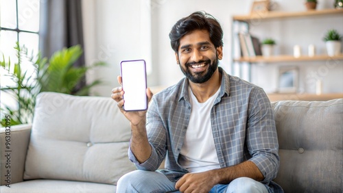  cheerful indian guy showing smartphone