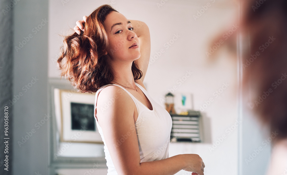 Reflection, mirror and woman in bedroom for hair care with natural, salon and morning routine at home. Health, beauty and female person with hairstyle inspection for growth treatment in apartment. Reflection, mirror and woman in bedroom for hair care with natural, salon and morning routine at home. Health, beauty and female person with hairstyle inspection for growth treatment in apartment.